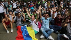 Anti-government demonstrator's chant slogans against the government during a protest in Caracas, Venezuela, Thursday, Feb. 12, 2015.