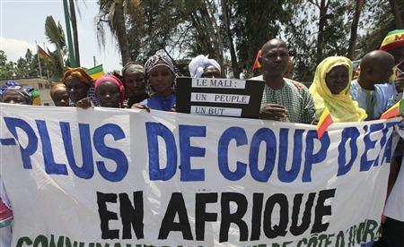 Citizens of Mali protest during the ECOWAS meeting, where the Mali crisis and Guinea-Bissau coup are discussed, in Abidjan